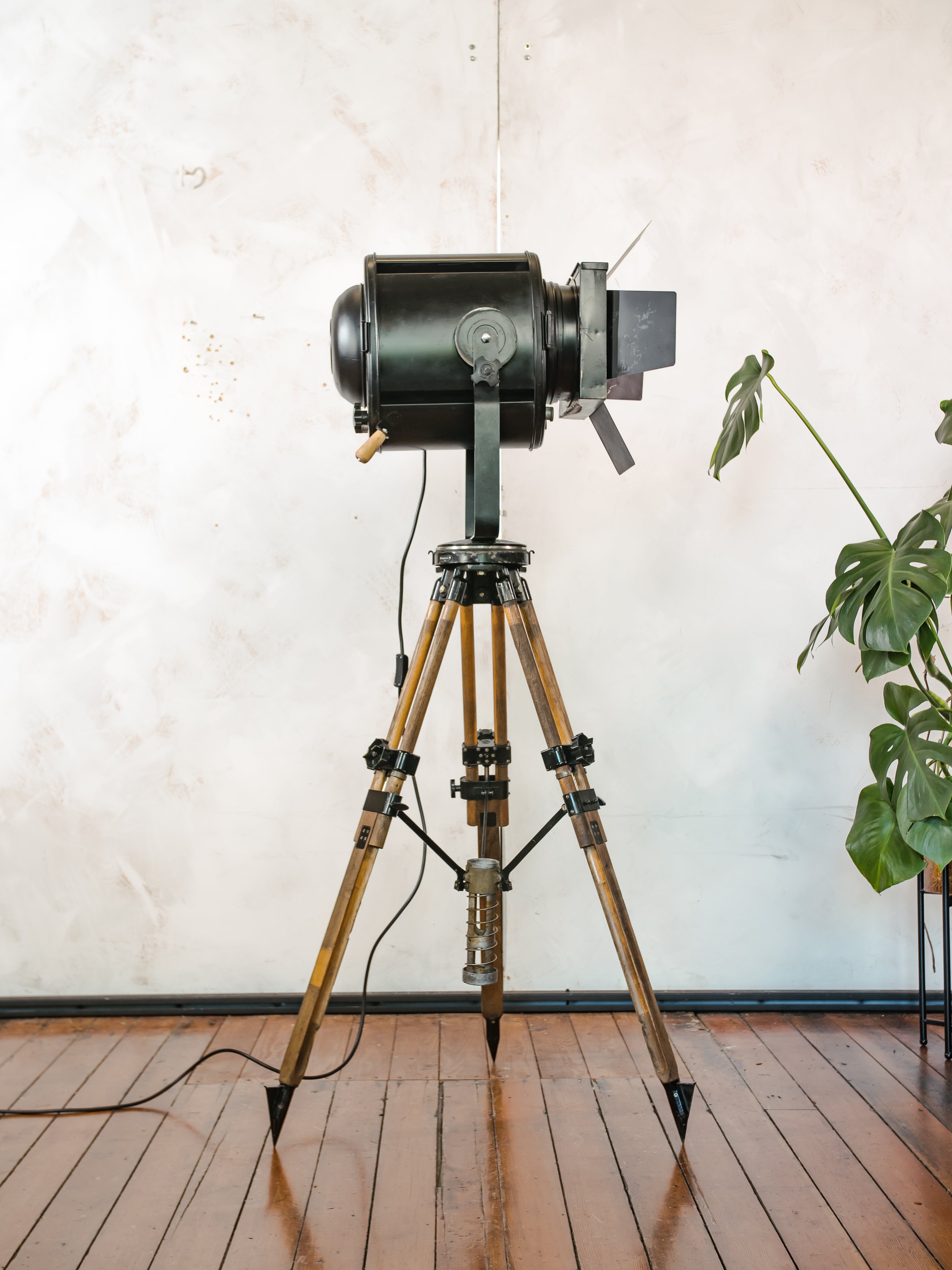 1950s Theater Spotlight Floor lamp A.E. Cremer Paris Projector on Vintage Wooden Surveyor Tripod, With Barndoors, French Antique Lighting
