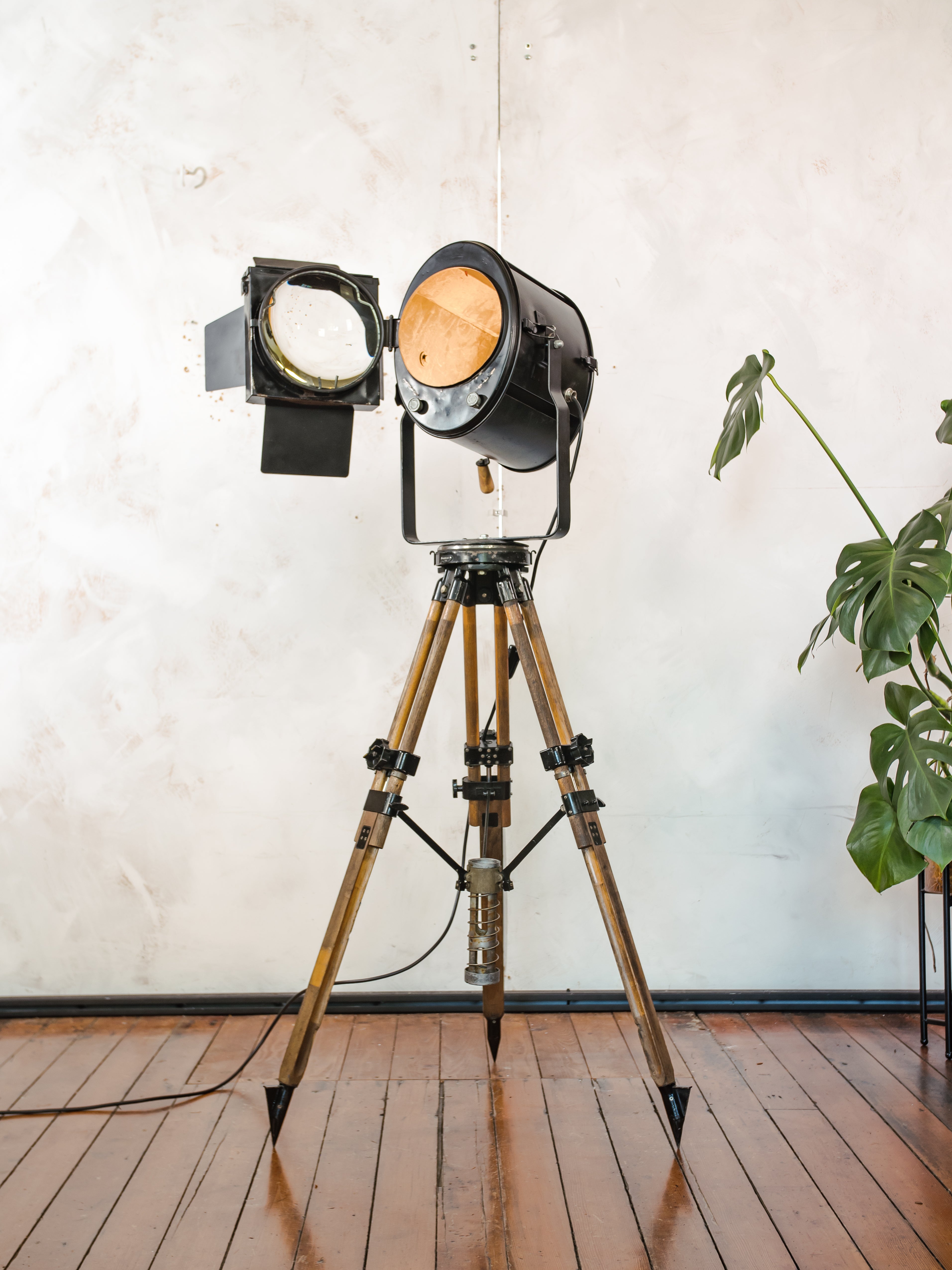 1950s Theater Spotlight Floor lamp A.E. Cremer Paris Projector on Vintage Wooden Surveyor Tripod, With Barndoors, French Antique Lighting