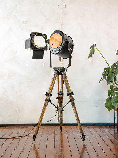1950s Theater Spotlight Floor lamp A.E. Cremer Paris Projector on Vintage Wooden Surveyor Tripod, With Barndoors, French Antique Lighting