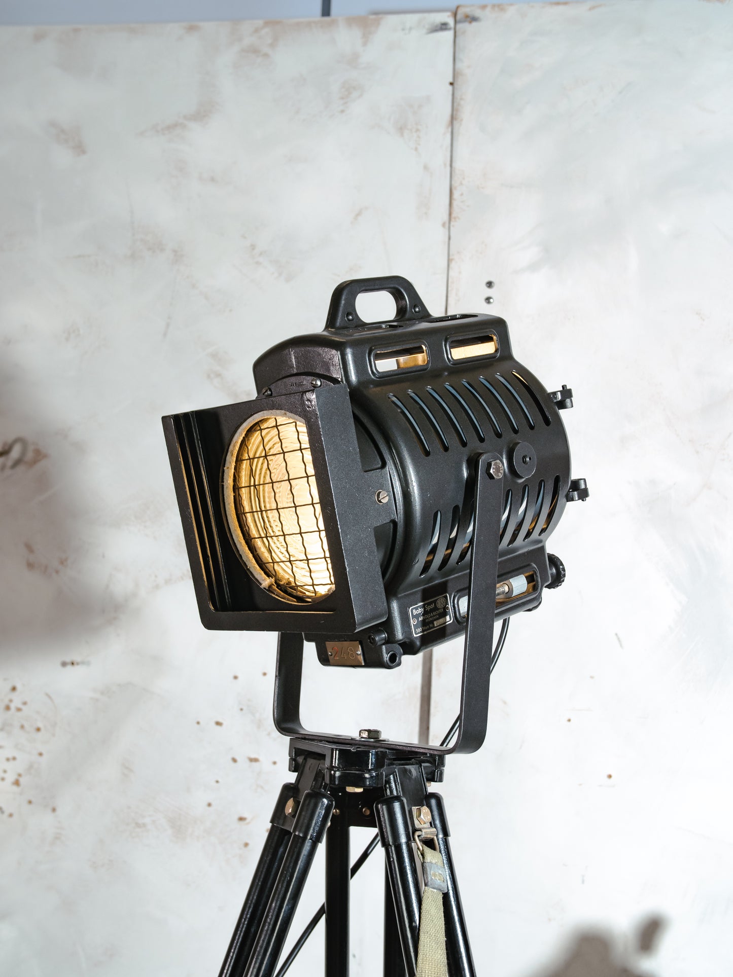 ARRI Cinema Lamp 1950s, Arnold & Richter 500 Watt Fresnel Baby Spotlight, Television lighting on a Black Surveying Tripod, Floorlamp