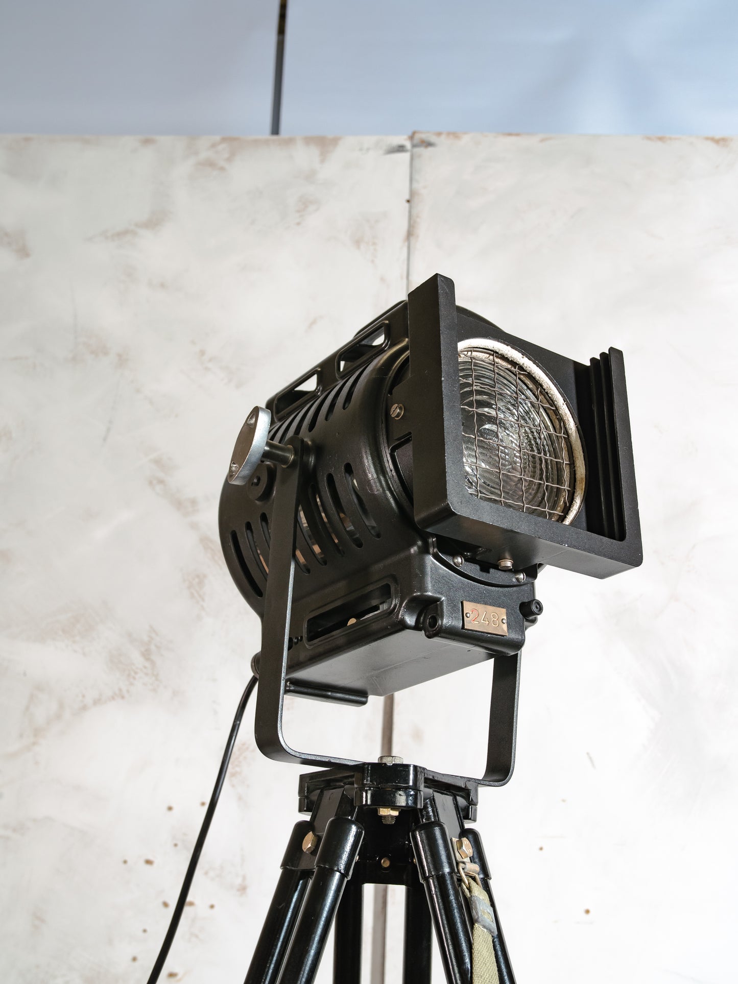 ARRI Cinema Lamp 1950s, Arnold & Richter 500 Watt Fresnel Baby Spotlight, Television lighting on a Black Surveying Tripod, Floorlamp