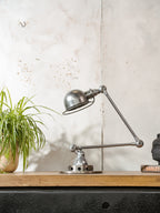 Polished 1950s Jieldé 2 Arm French Workshop Lamp on Brake disc, Jielde light, Vintage Designer Desk Lamp made by Jean Louis Domecq