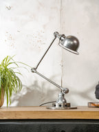 Polished 1950s Jieldé 2 Arm French Workshop Lamp on Brake disc, Jielde light, Vintage Designer Desk Lamp made by Jean Louis Domecq
