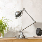 Polished 1950s Jieldé 2 Arm French Workshop Lamp on Brake disc, Jielde light, Vintage Designer Desk Lamp made by Jean Louis Domecq