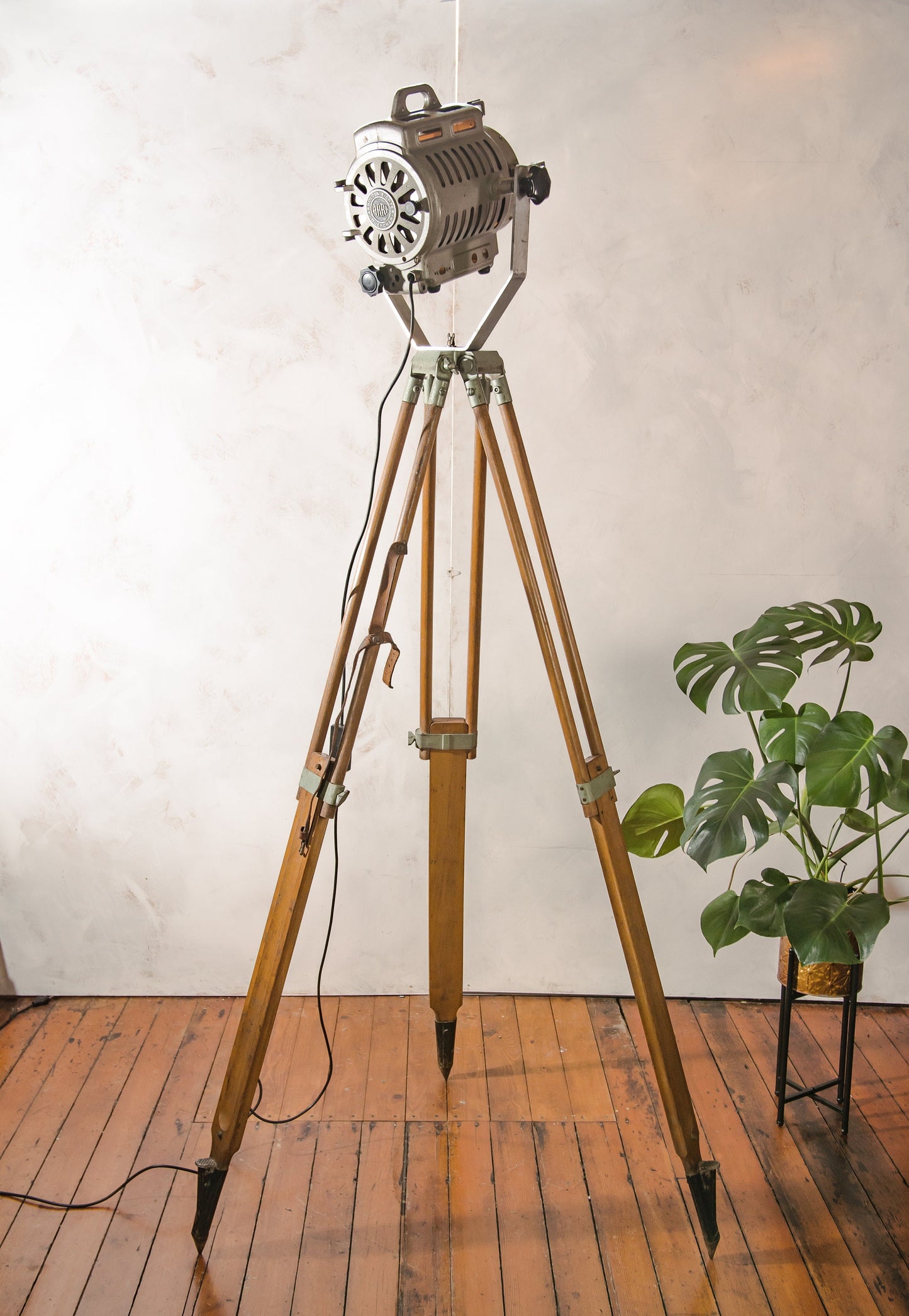 1950s ARRI Arnold & Richter Vintage Hollywood Film Spotlight, German Studio Spot light on a Vintage Wooden Surveyors Tripod