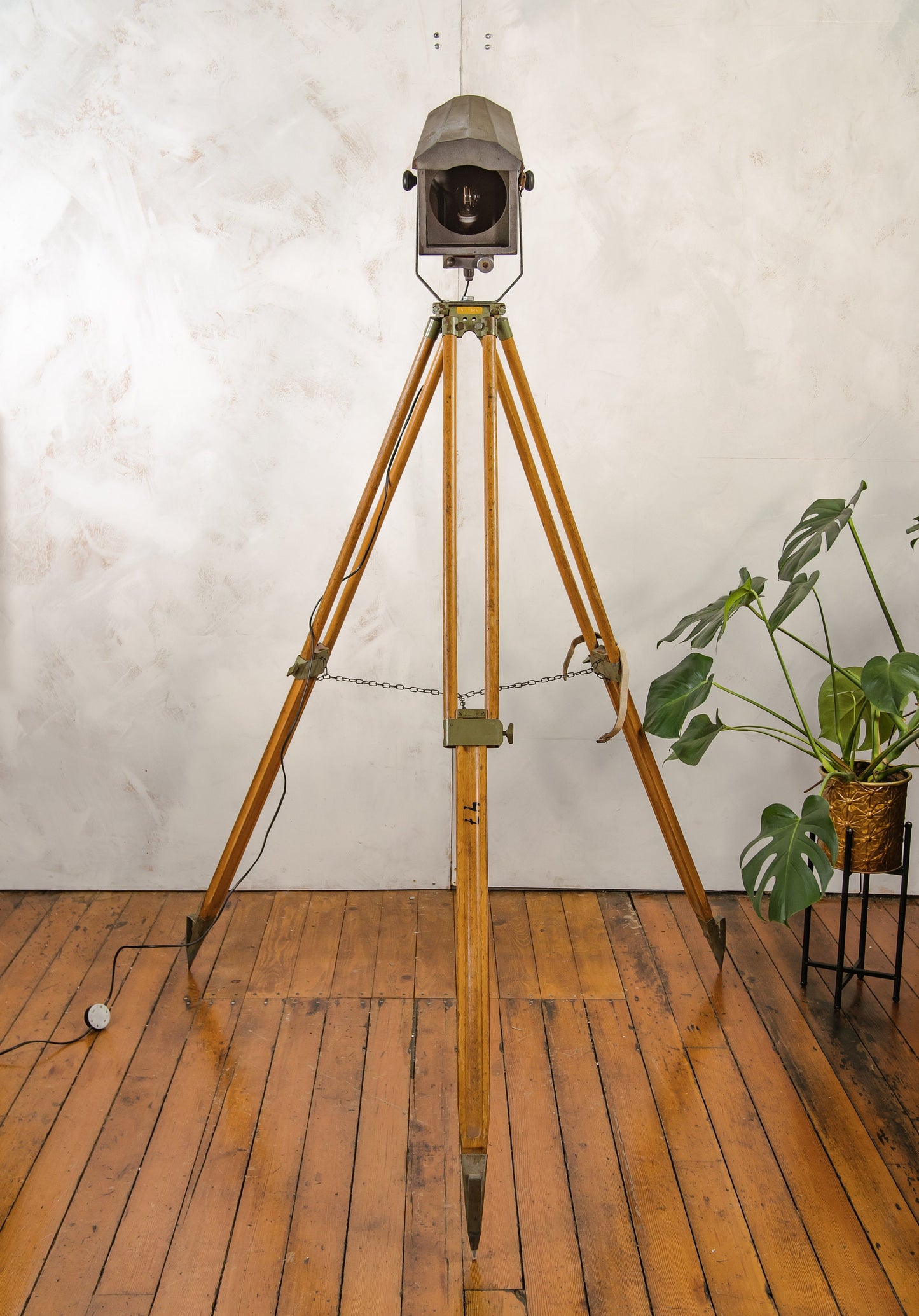 French Theatre Spotlight Floor lamp, Made by Falconet & Cie Paris, Stage light on a Wooden Surveying Tripod, Industrial interior lighting