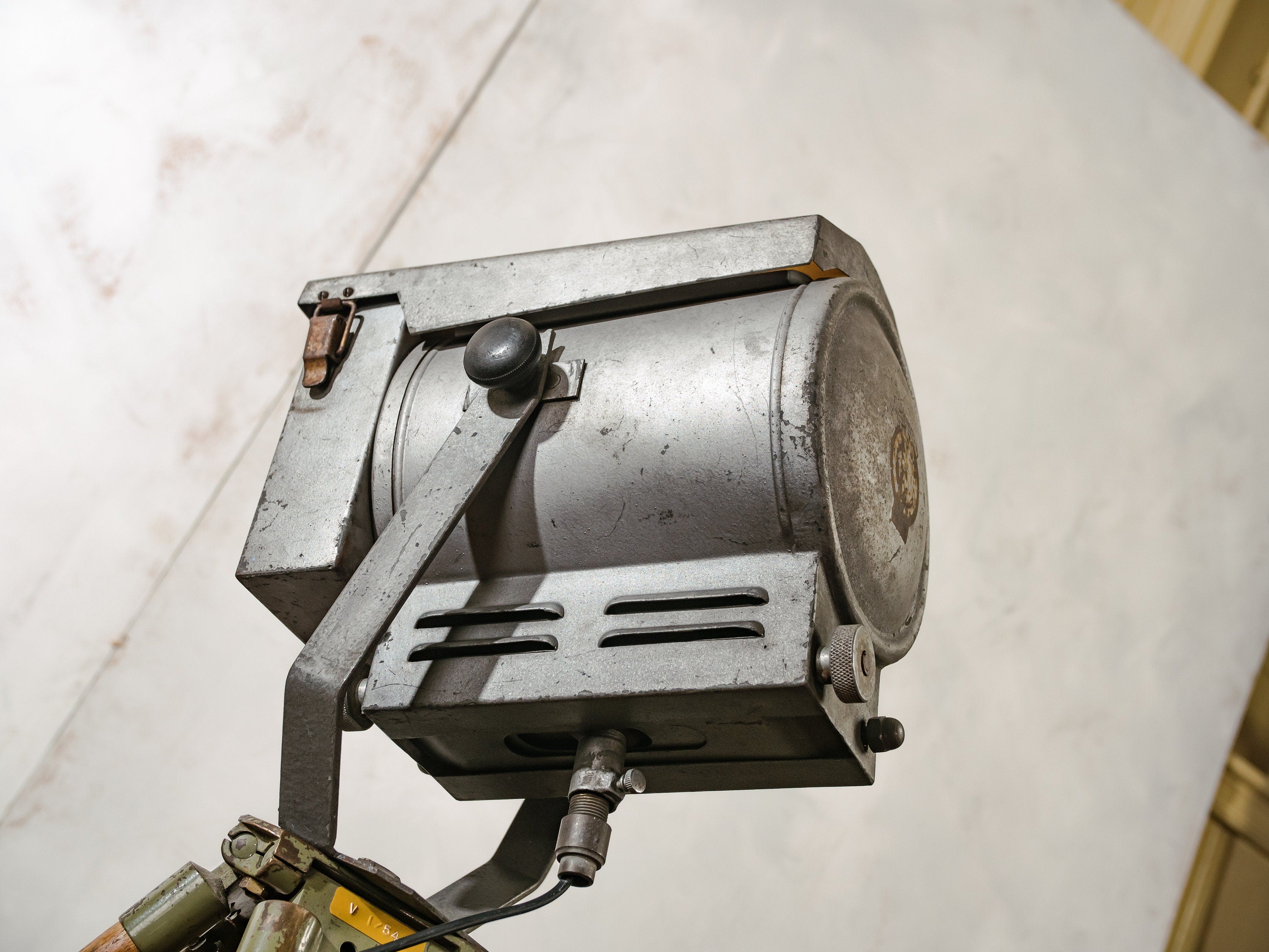 French Theatre Spotlight Floor lamp, Made by Falconet & Cie Paris, Stage light on a Wooden Surveying Tripod, Industrial interior lighting